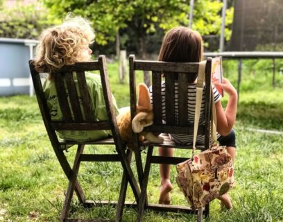 Kids sitting on deck chairs