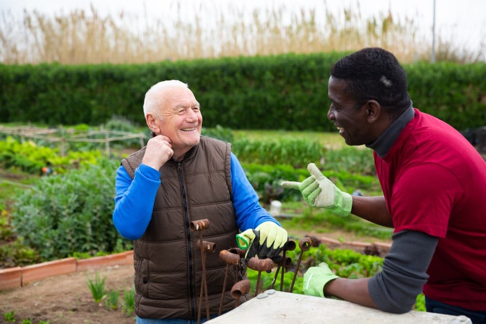 Two generations sharing gardening tips