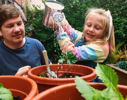 Family growing veg plants